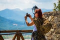 Woman is wearing a skirt and scarf in Meteora Monastery Royalty Free Stock Photo